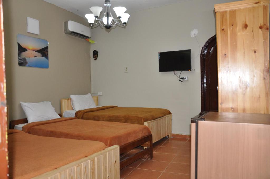 Postel nebo postele na pokoji v ubytování Dahab Plaza Hotel