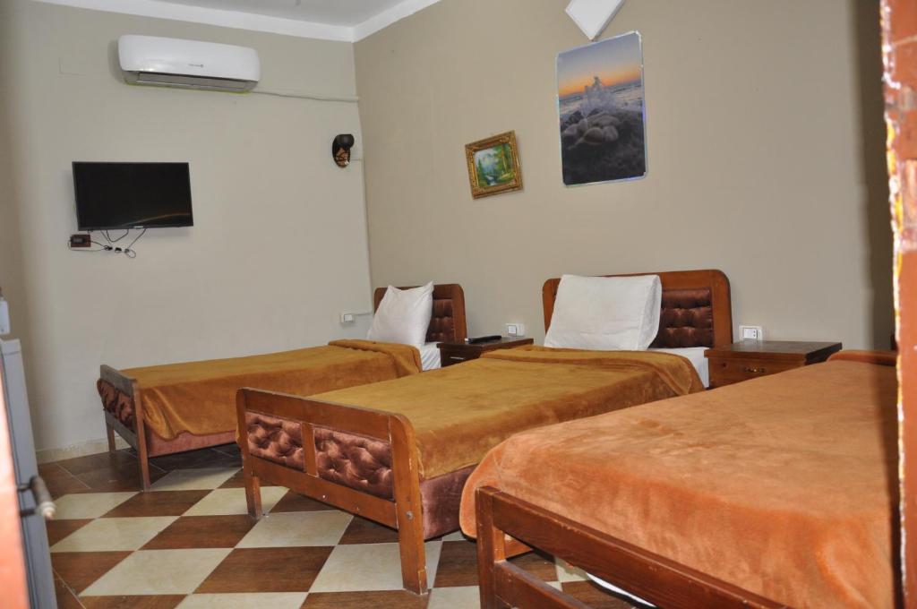 Postel nebo postele na pokoji v ubytování Dahab Plaza Hotel