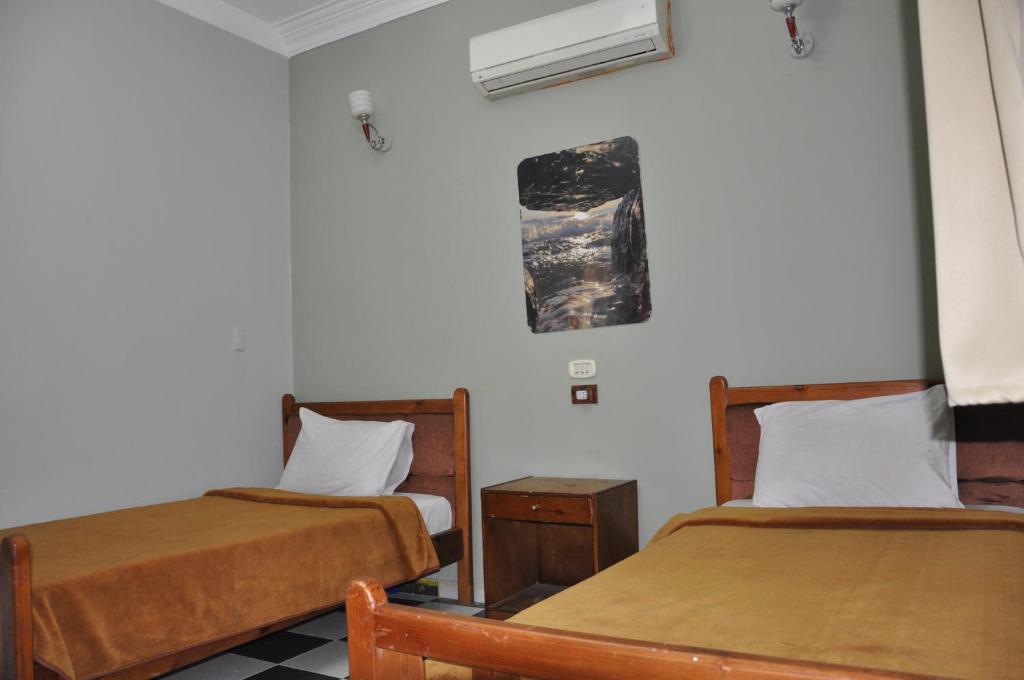 Postel nebo postele na pokoji v ubytování Dahab Plaza Hotel