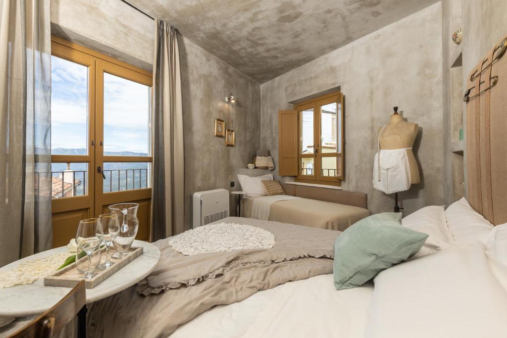 Postel nebo postele na pokoji v ubytování Via Roma Charming Rooms