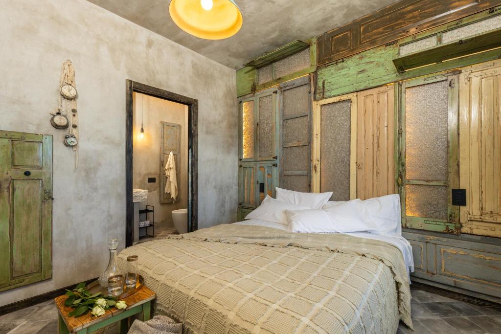 Postel nebo postele na pokoji v ubytování Via Roma Charming Rooms