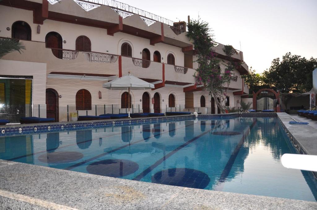 a large swimming pool in front of a building at Dahab Plaza Hotel in Dahab