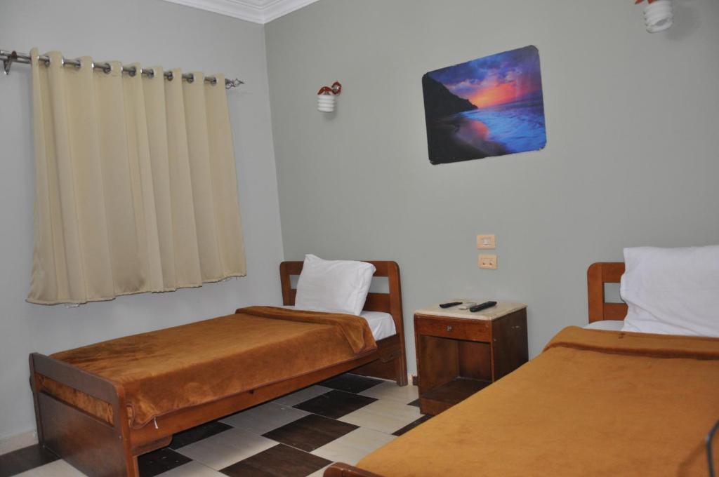 Postel nebo postele na pokoji v ubytování Dahab Plaza Hotel