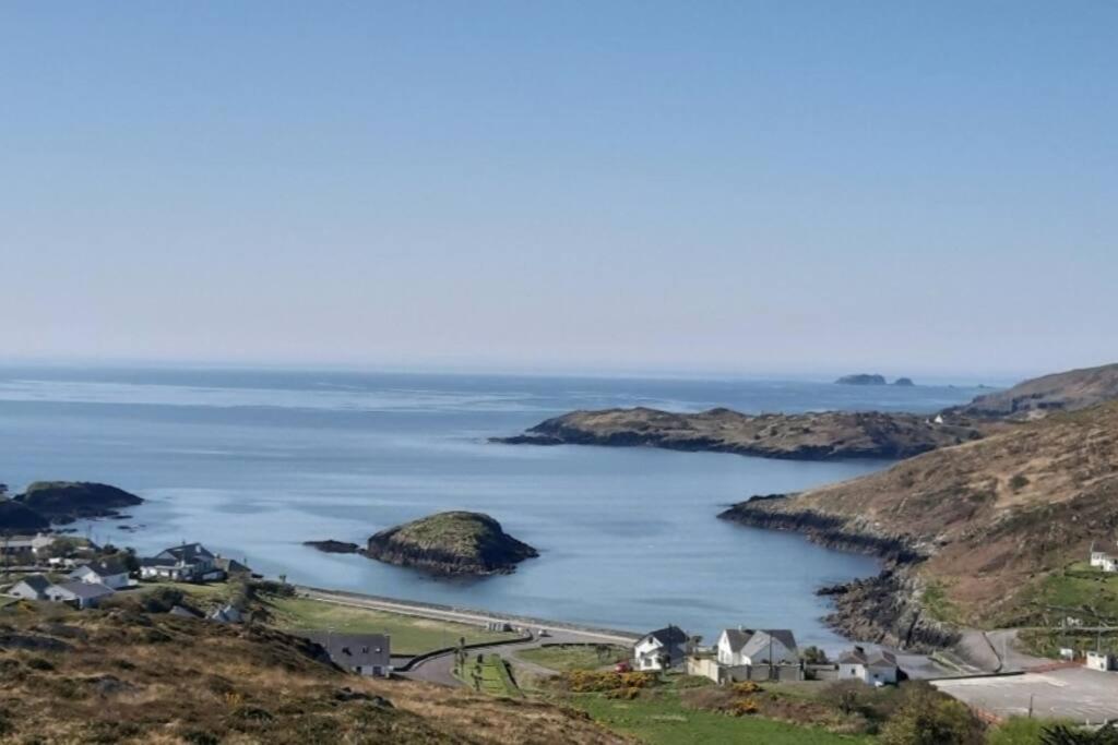a view of a body of water with houses and islands at The Hideaway Tragumna a hidden gem in the hills in Drishanebeg