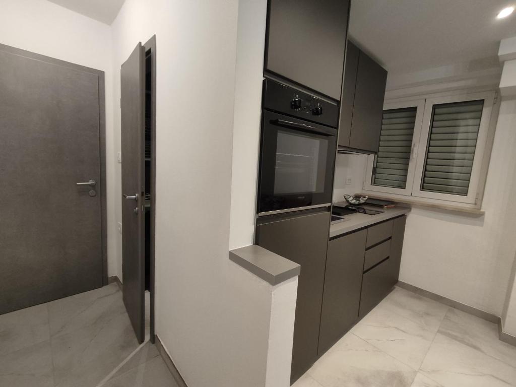 Kuchyň nebo kuchyňský kout v ubytování Apartments Samec