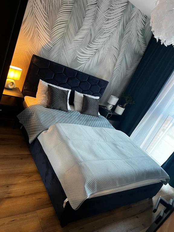 Cama o camas de una habitación en Danio Apart Old Town Gdańsk