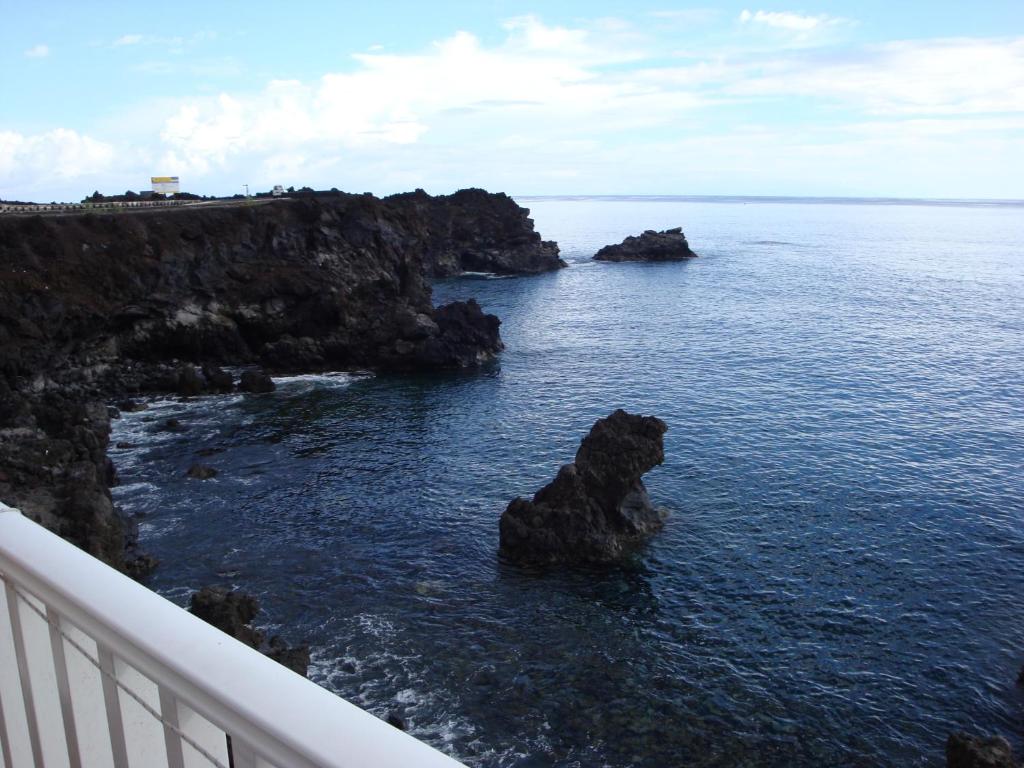 a view of the ocean from a balcony at Apartamentos Boomerang I in Tamaduste