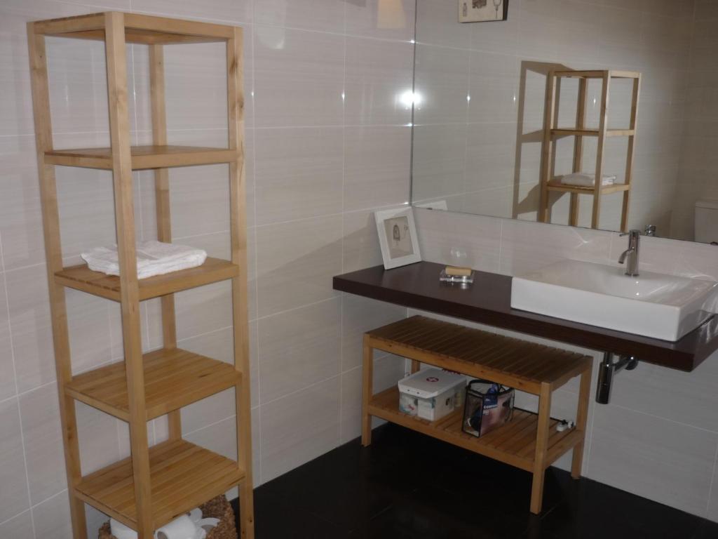 a bathroom with a sink and a mirror at Casa da Terra in Góis