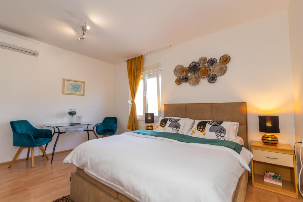 Postel nebo postele na pokoji v ubytování Matic Apartments