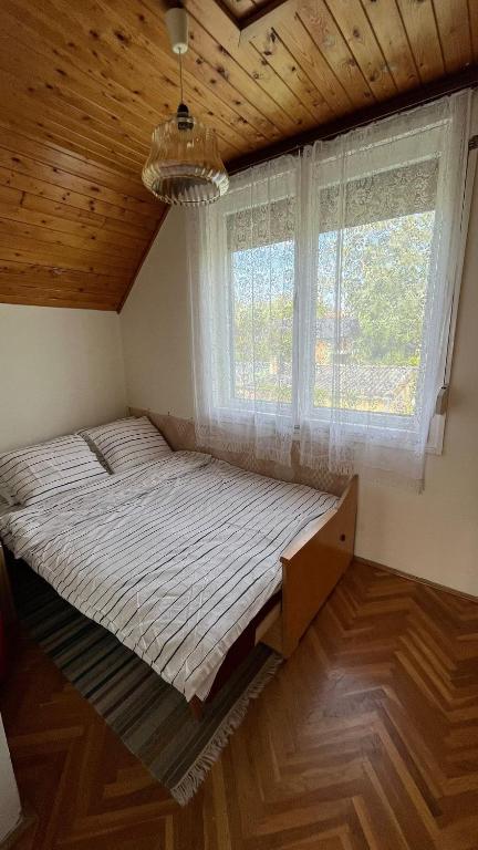 Posteľ alebo postele v izbe v ubytovaní Vitorlás Haus