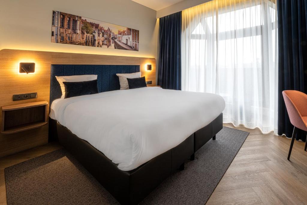 Postel nebo postele na pokoji v ubytování Gresham Belson Hotel Brussels