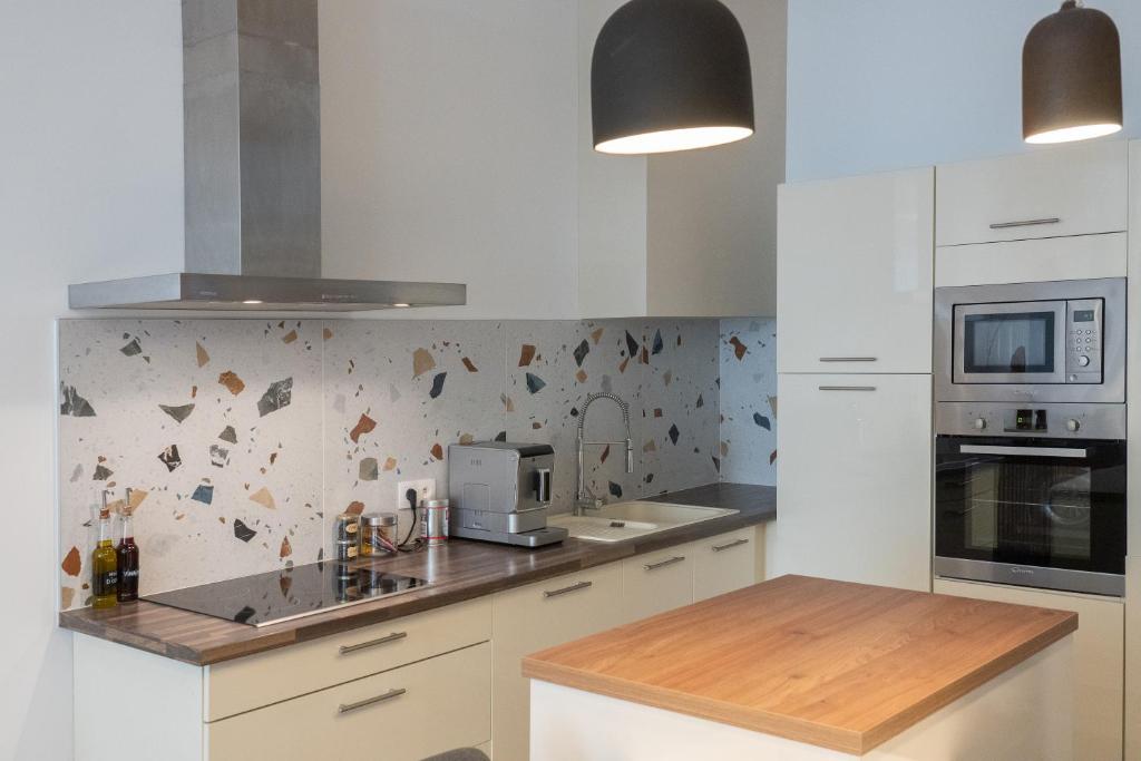 Kuchyňa alebo kuchynka v ubytovaní Appartement Haussmannien à Sète