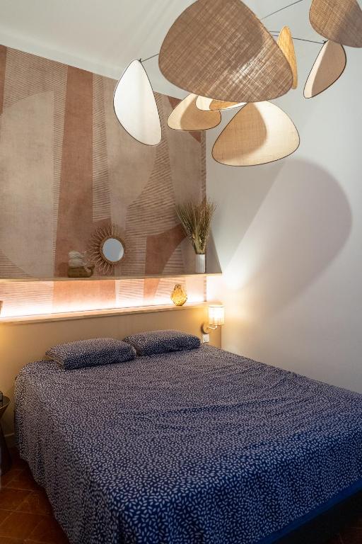 Posteľ alebo postele v izbe v ubytovaní Appartement Haussmannien à Sète