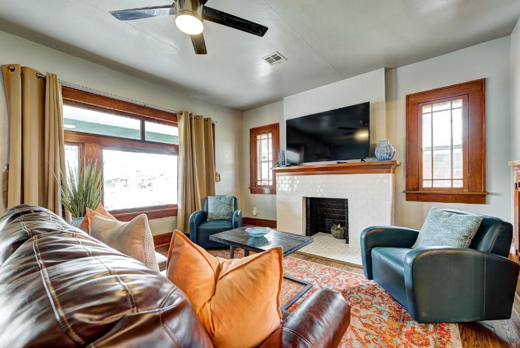 a living room with a couch and a fireplace at Classen Craftsman-near Asian & Paseo district in Oklahoma City