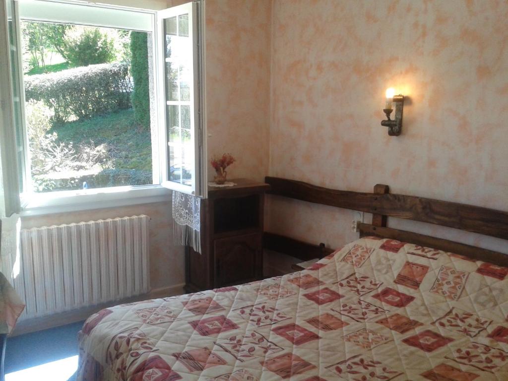 Postel nebo postele na pokoji v ubytování La Cremaillere