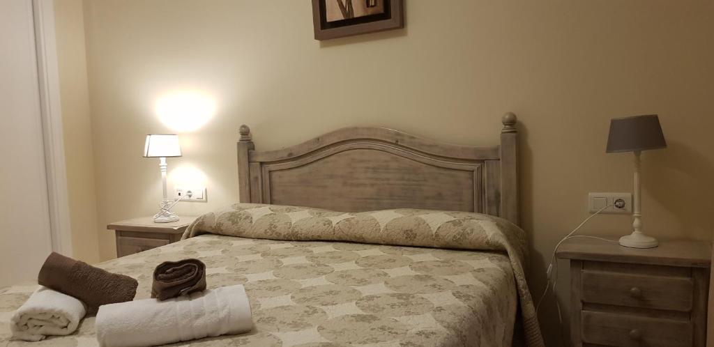 Postel nebo postele na pokoji v ubytování Nerja Zona playa de Burriana