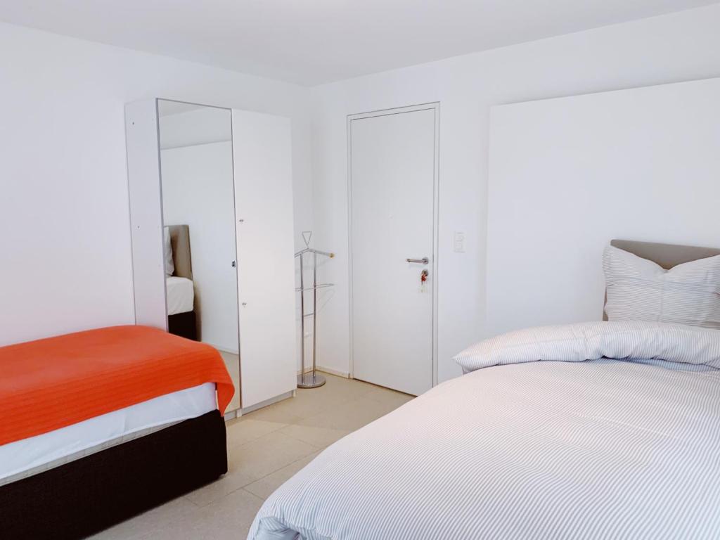 Postel nebo postele na pokoji v ubytování N1 Standalone House Baden