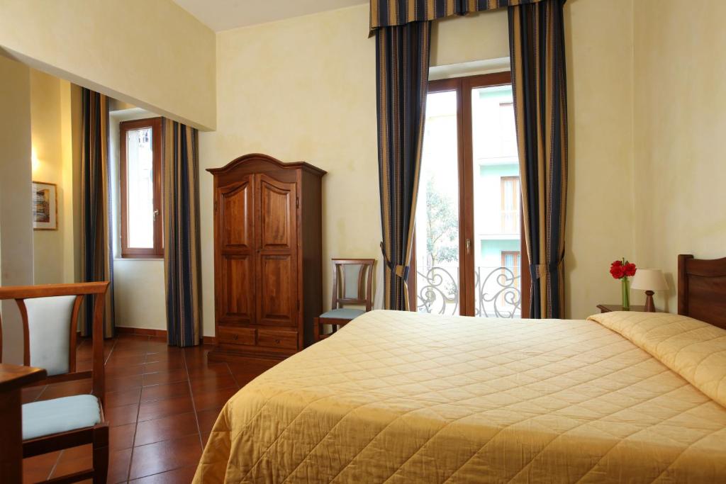 Posteľ alebo postele v izbe v ubytovaní Hotel Bologna