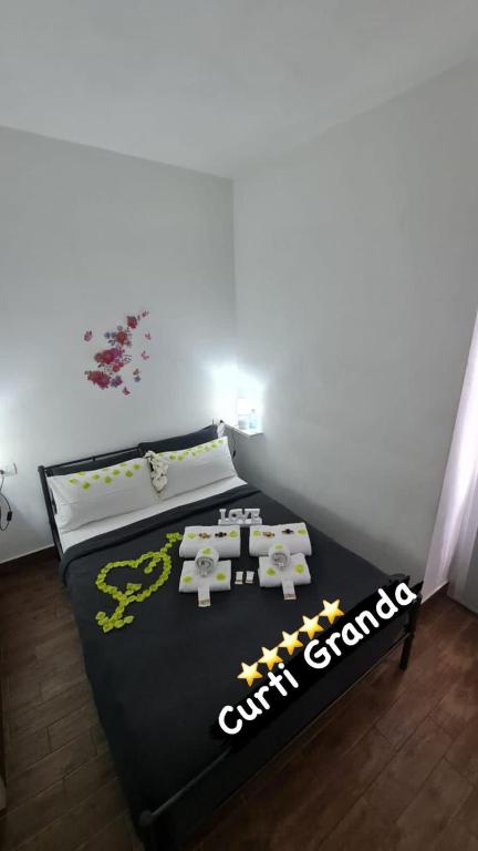 Postel nebo postele na pokoji v ubytování Curti Granda
