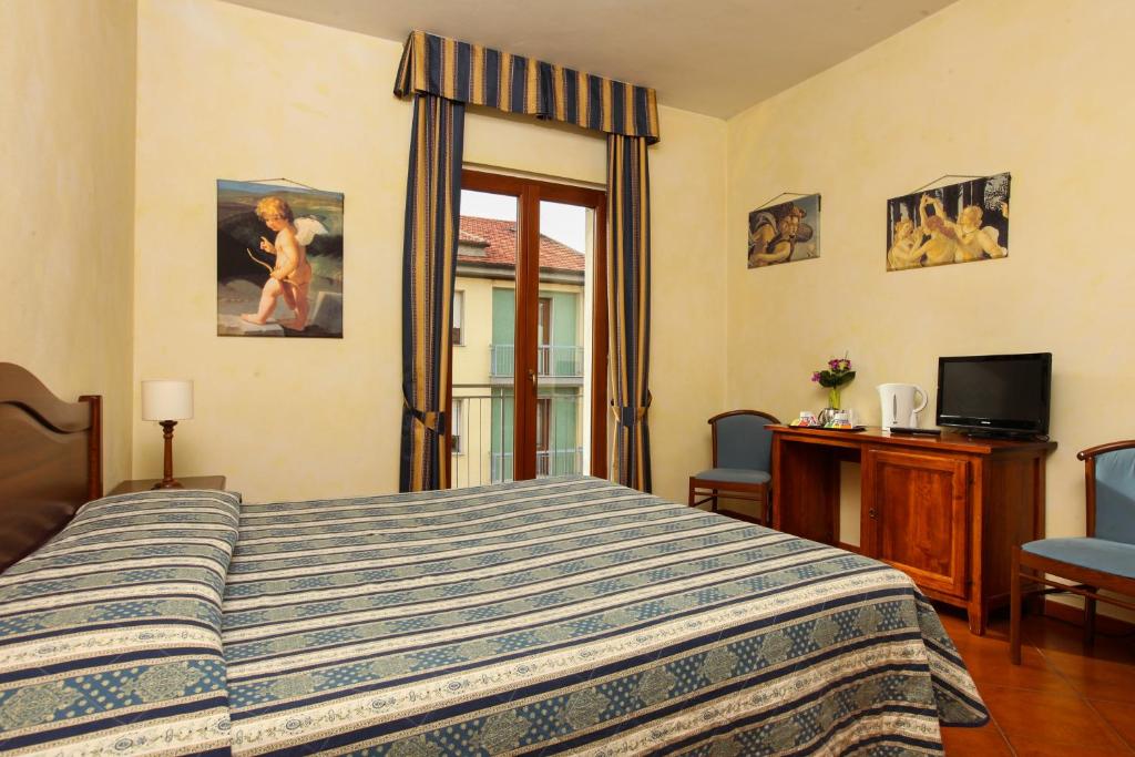 Posteľ alebo postele v izbe v ubytovaní Hotel Bologna