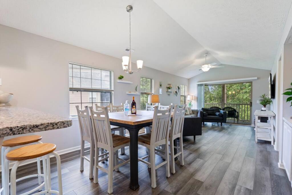 a kitchen and dining room with a table and chairs at Beach Place at True Blue - Close to the beach! in Pawleys Island