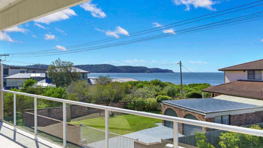 a view of the ocean from the balcony of a house at Beach Break - Umina Beach Water Views in Umina