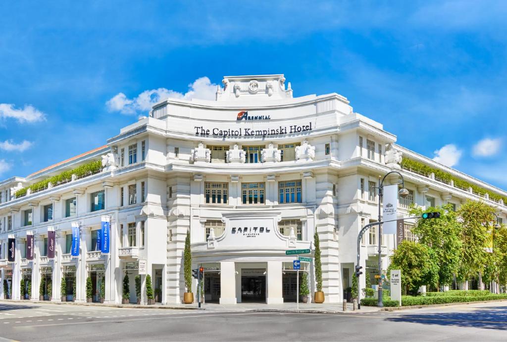 a white building on the corner of a street at The Capitol Kempinski Hotel Singapore in Singapore