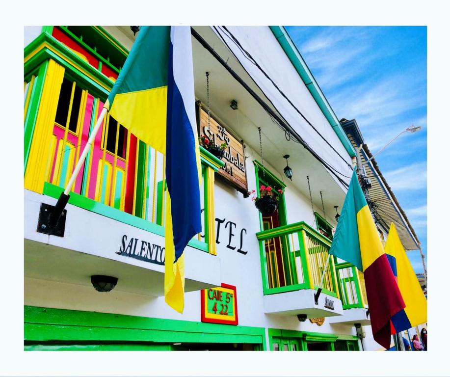 a building with flags on the side of it at HOTEL SHAMBALA in Salento