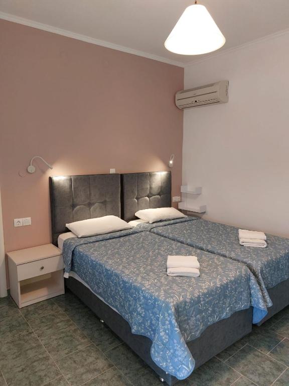 Postel nebo postele na pokoji v ubytování Dolphin Sea View Rooms