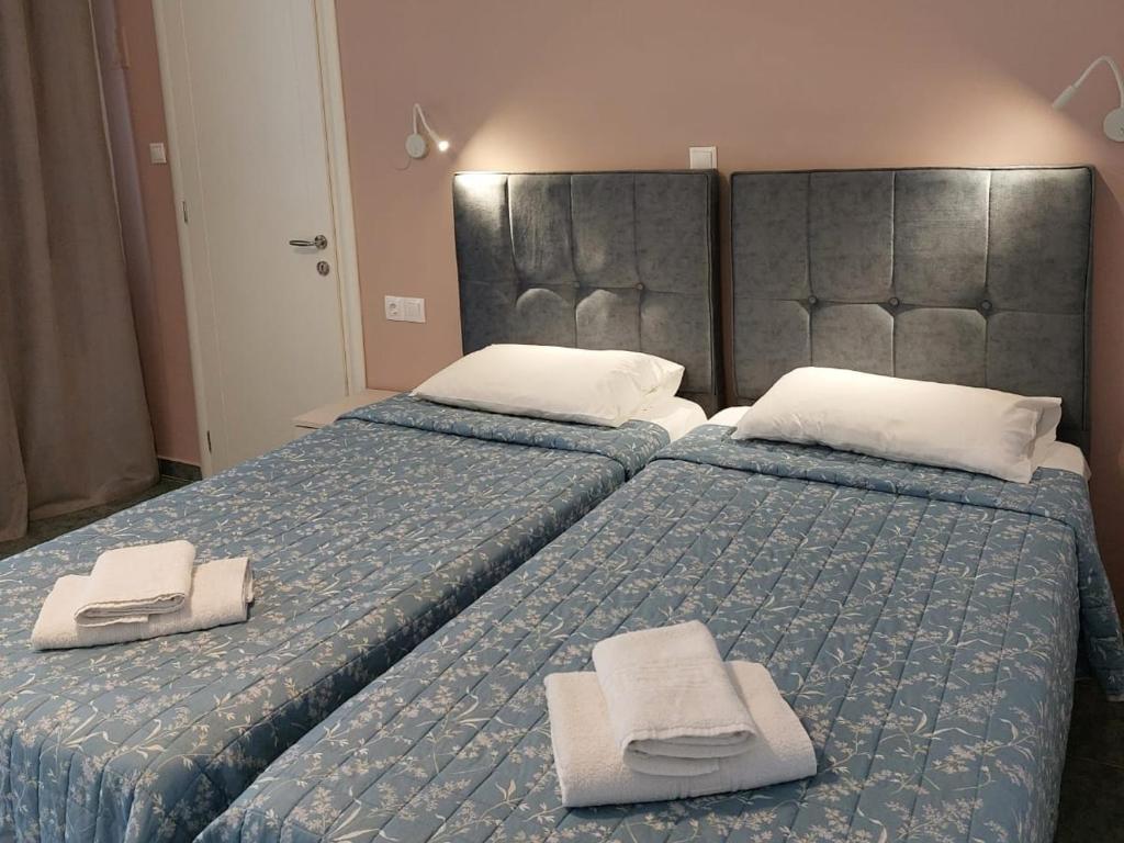 Postel nebo postele na pokoji v ubytování Dolphin Sea View Rooms