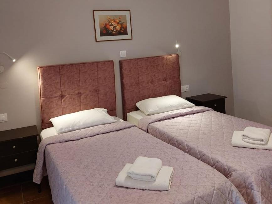 Postel nebo postele na pokoji v ubytování Dolphin Sea View Rooms