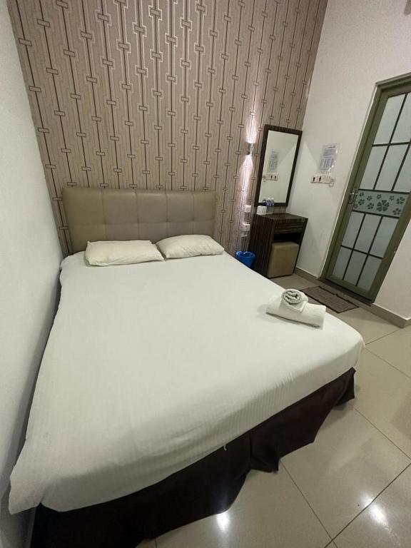 Postel nebo postele na pokoji v ubytování One Point Hotel @ Airport (Kuching)