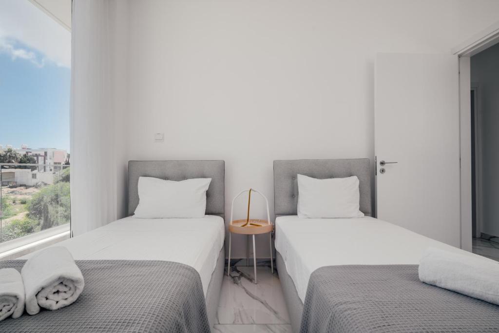 Postel nebo postele na pokoji v ubytování Protaras Olivia Pearl Villa