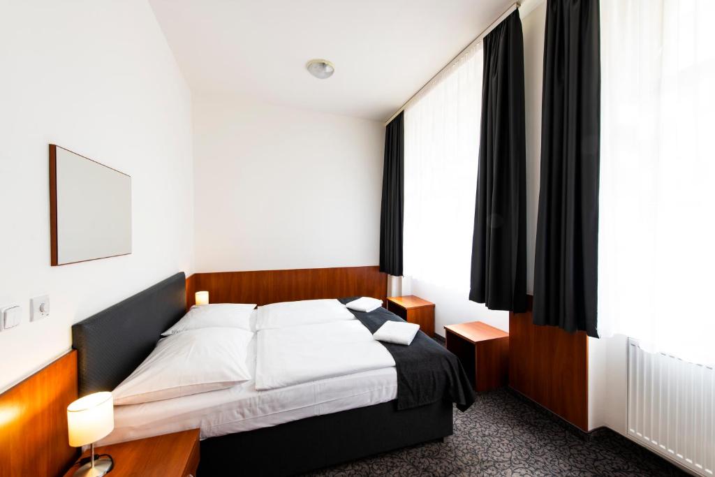 Postel nebo postele na pokoji v ubytování Hotel Zlatá Váha
