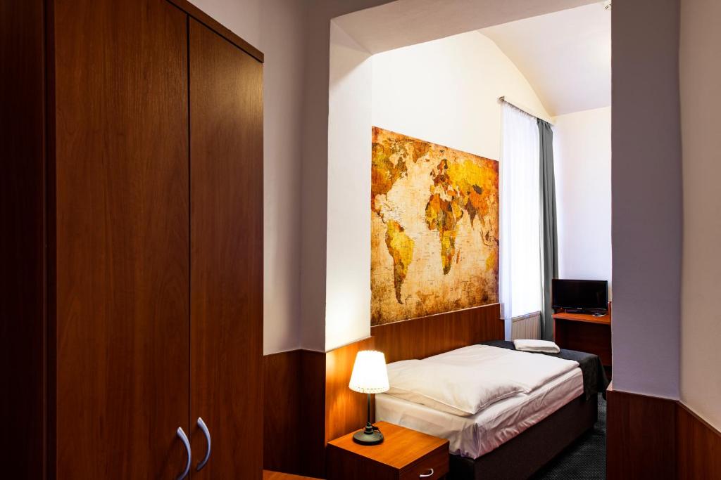 Postel nebo postele na pokoji v ubytování Hotel Zlatá Váha