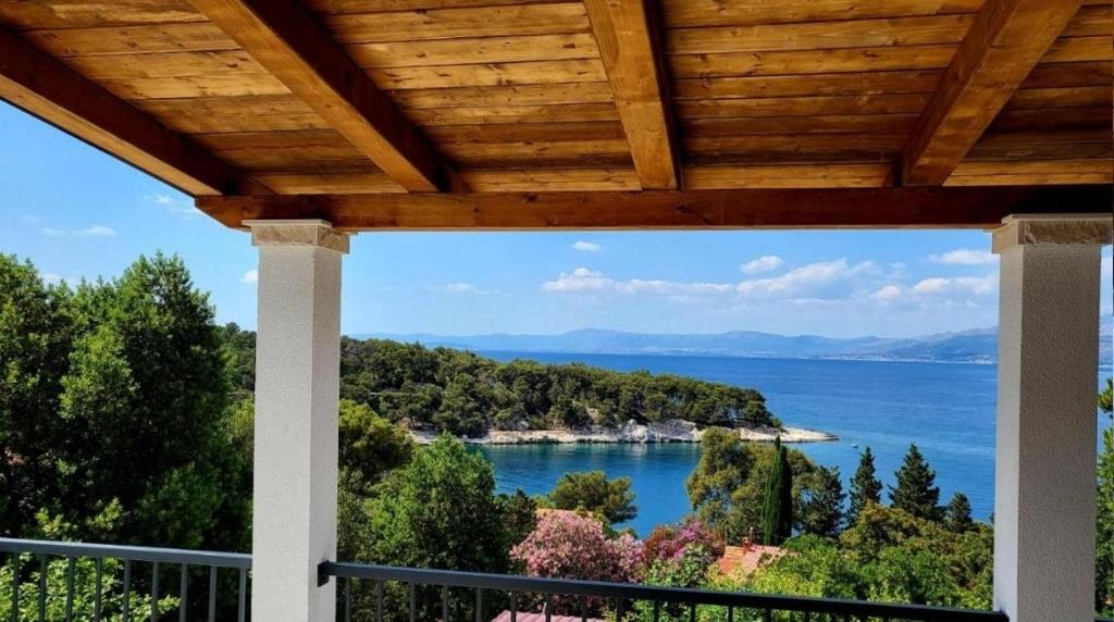 a view of the ocean from a porch at Seaview Residence in Splitska