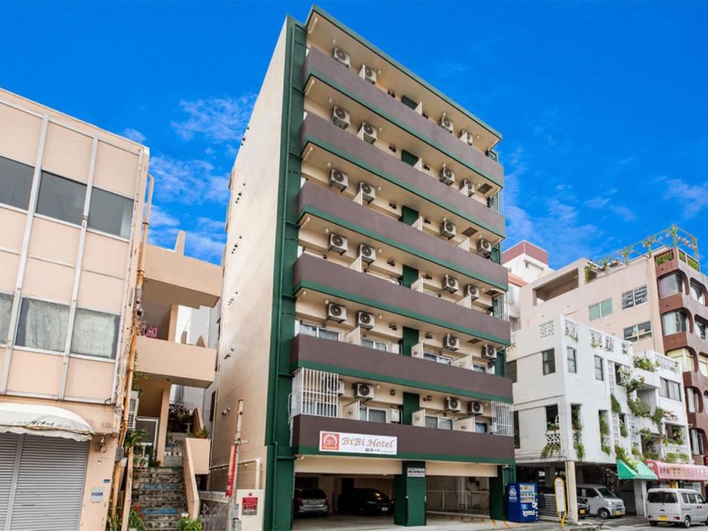 a building with balconies on the side of it at BiBi Hotel 泊ポート in Naha