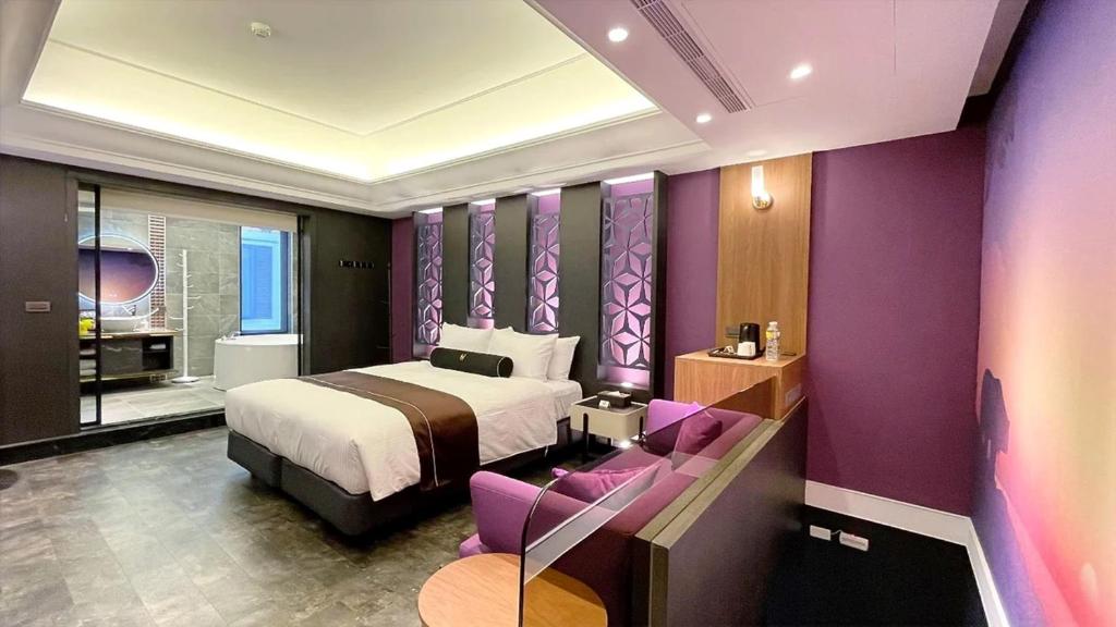 Postel nebo postele na pokoji v ubytování H Motel璽悅國際精品旅館