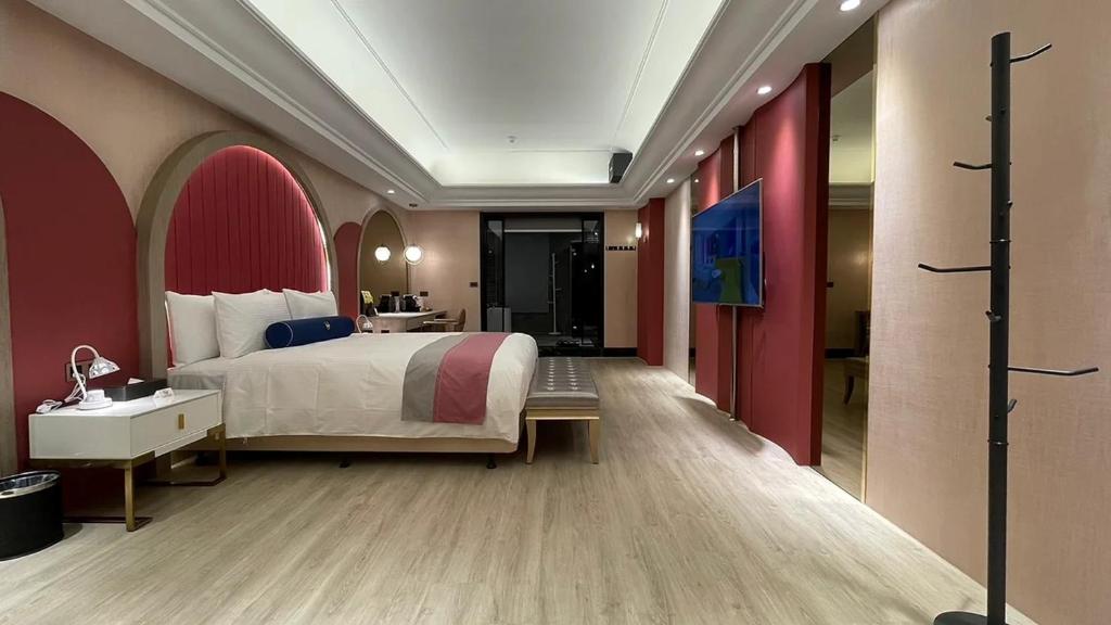 Postel nebo postele na pokoji v ubytování H Motel璽悅國際精品旅館