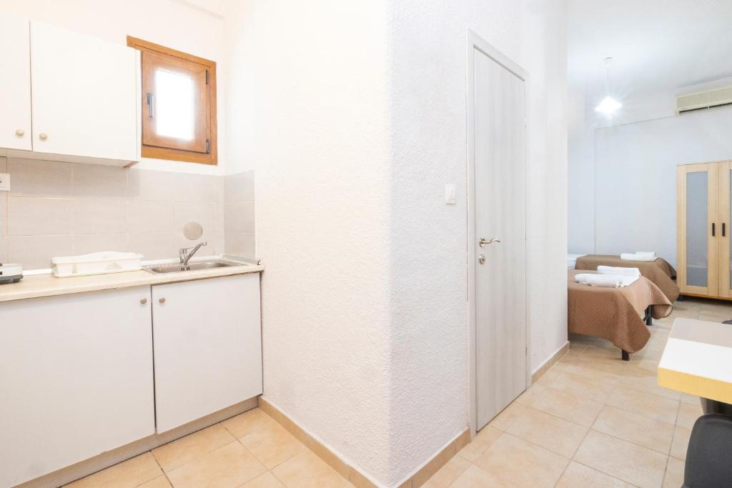 Postel nebo postele na pokoji v ubytování Alexandra Studios