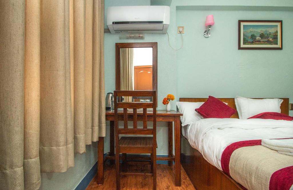 Postel nebo postele na pokoji v ubytování Thamel Eco Home