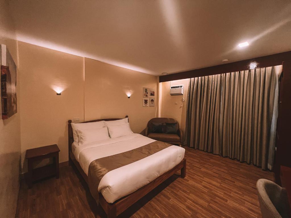 Postel nebo postele na pokoji v ubytování Rufana Suites