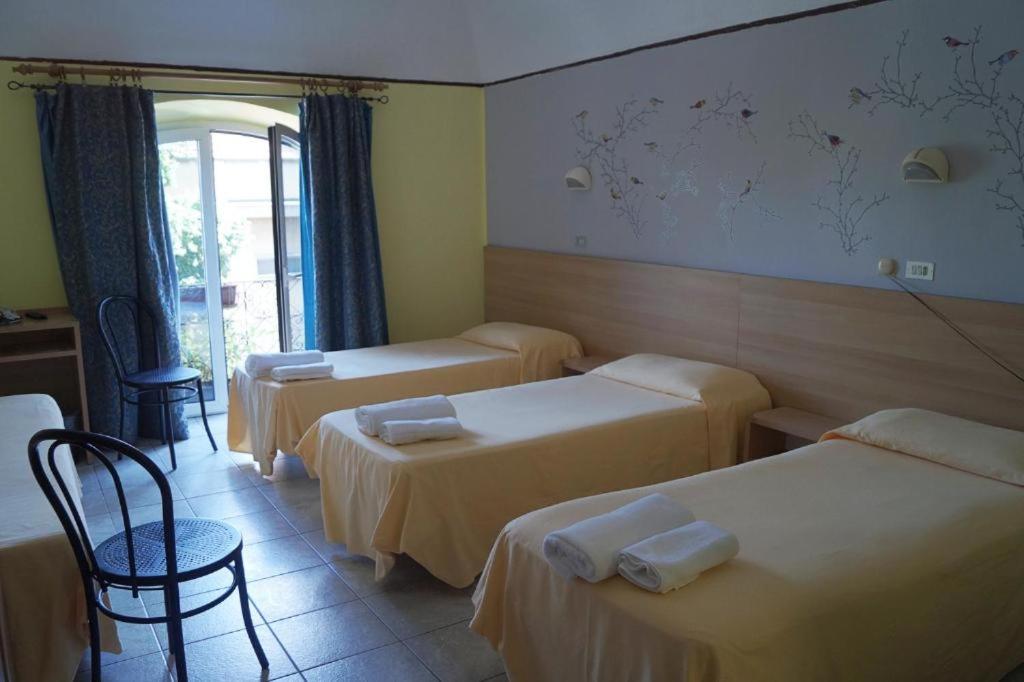 Postel nebo postele na pokoji v ubytování Hotel Stazione