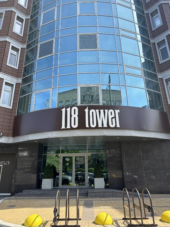 a building with a sign that reads tower at 118 apartments in Kyiv