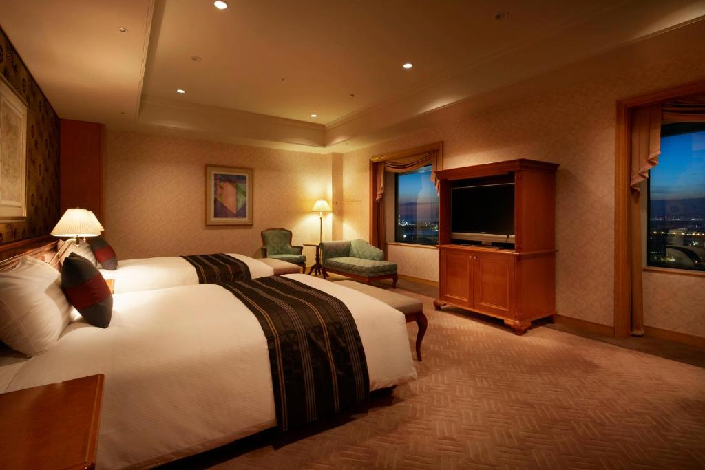 Postel nebo postele na pokoji v ubytování Hotel Agora Regency Osaka Sakai