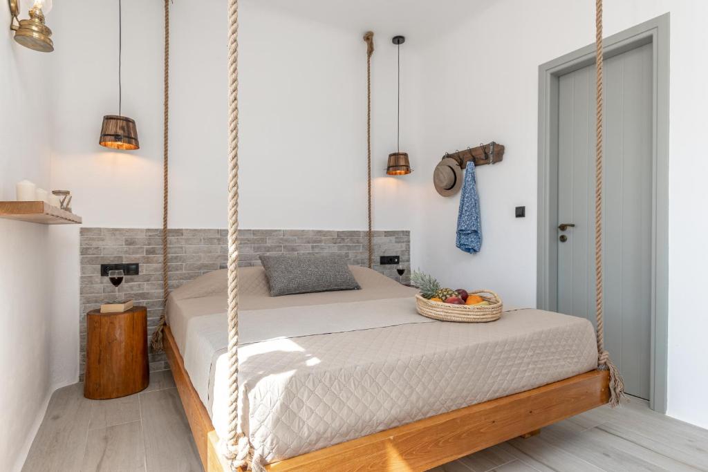 A bed or beds in a room at Sunshine Plaka Naxos