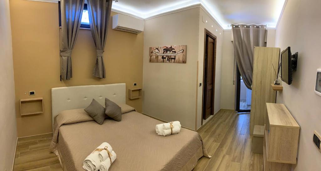 Posteľ alebo postele v izbe v ubytovaní Emyteo Apartment