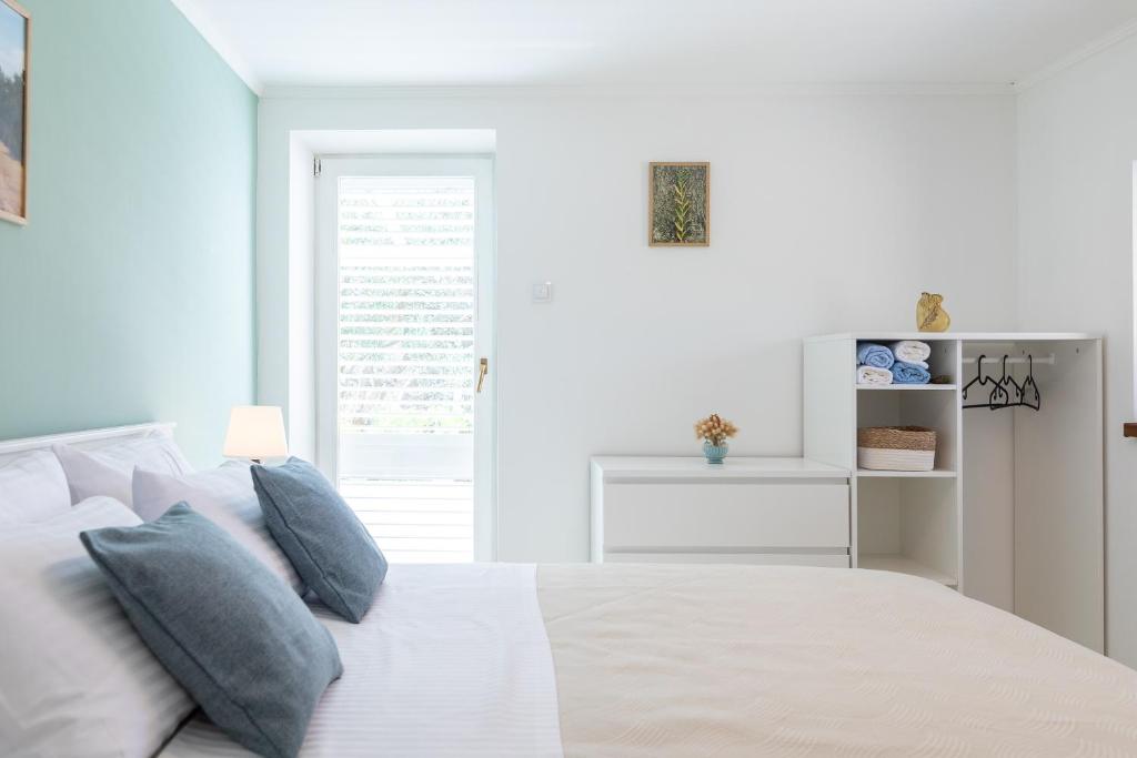Postel nebo postele na pokoji v ubytování House Potirna