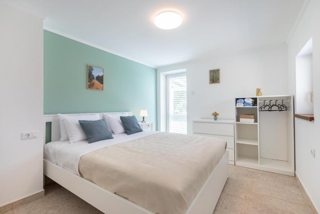 Postel nebo postele na pokoji v ubytování House Potirna