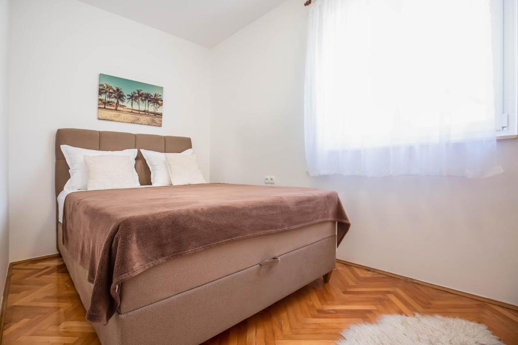 Posteľ alebo postele v izbe v ubytovaní Beach Apartments Croatia